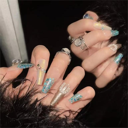 Sparkling Glitter Nails for Summer Soirees: Add some sparkle to your summer with glittering nail designs that shimmer and shine in the sunlight.   From subtle glitter accents to full-on glam, these dazzling manicures are perfect for special occasions and celebrations.